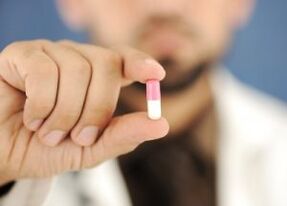 the doctor offers a capsule to treat lower back pain